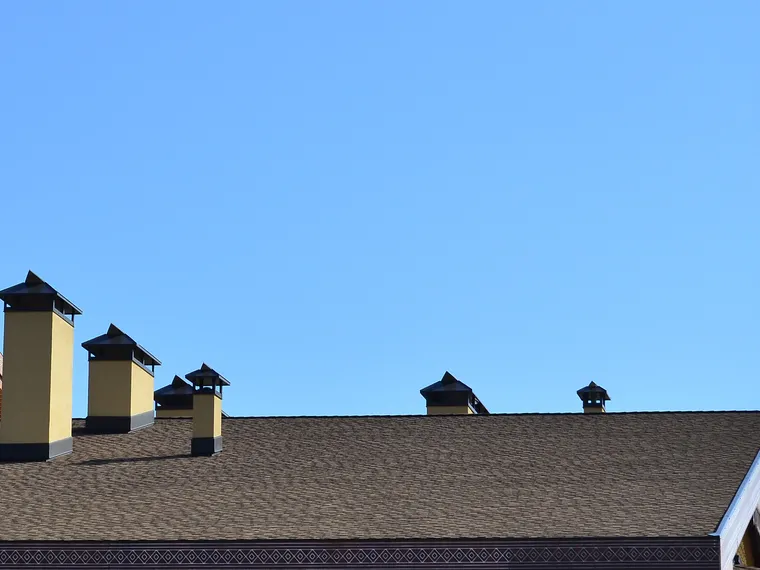 Rooftop and chimneys under a Colorado sky
