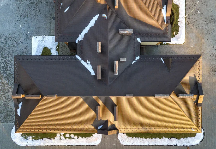 Aerial view of a brown shingled roof