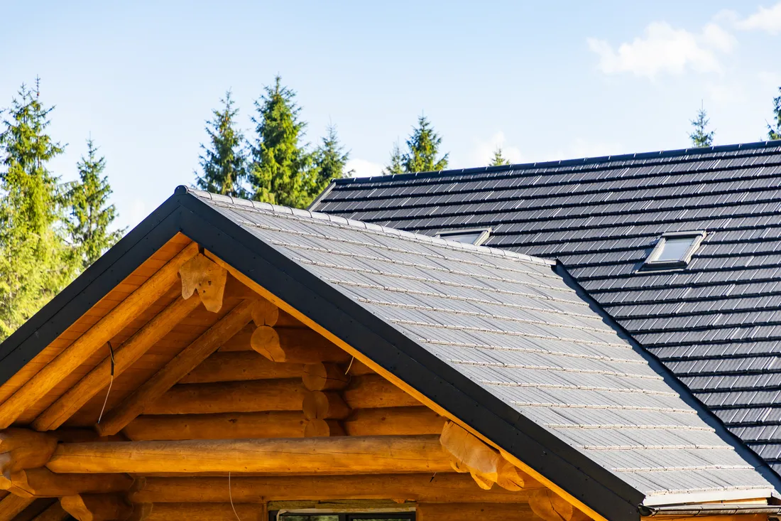 Home with a contemporary standing seam metal roof