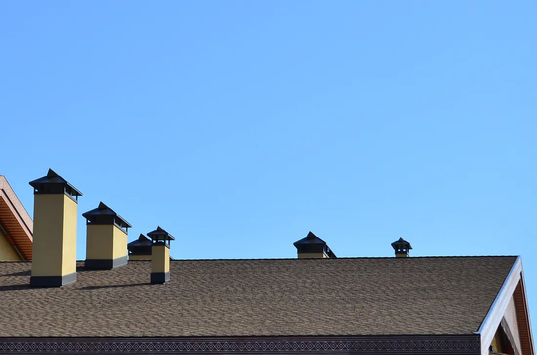 Rooftop with chimneys on a clear Colorado day